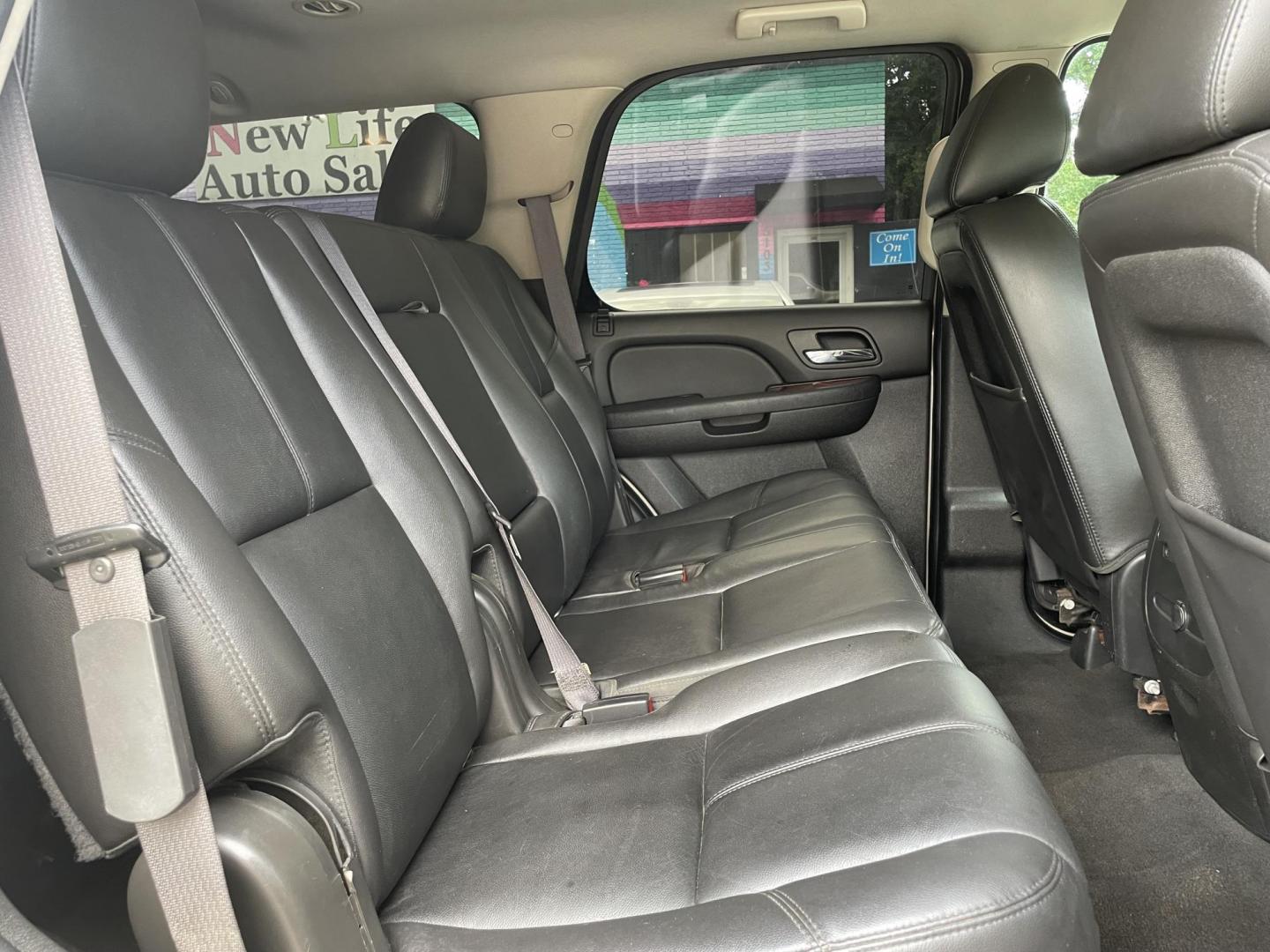 2013 GOLD GMC YUKON SLT (1GKS2CE08DR) with an 5.3L engine, Automatic transmission, located at 5103 Dorchester Rd., Charleston, SC, 29418-5607, (843) 767-1122, 36.245171, -115.228050 - Clean Interior with Leather, CD/AUX/Sat, OnStar, Dual Climate, Power Everything (windows, locks, seats, mirrors), Heated Seats, Convenient Third Row, Rear Climate Control, Keyless Entry, Tow Package, Alloy Wheels. Clean CarFax (no accidents reported!) 185k miles Located at New Life Auto Sales! 2023 - Photo#13