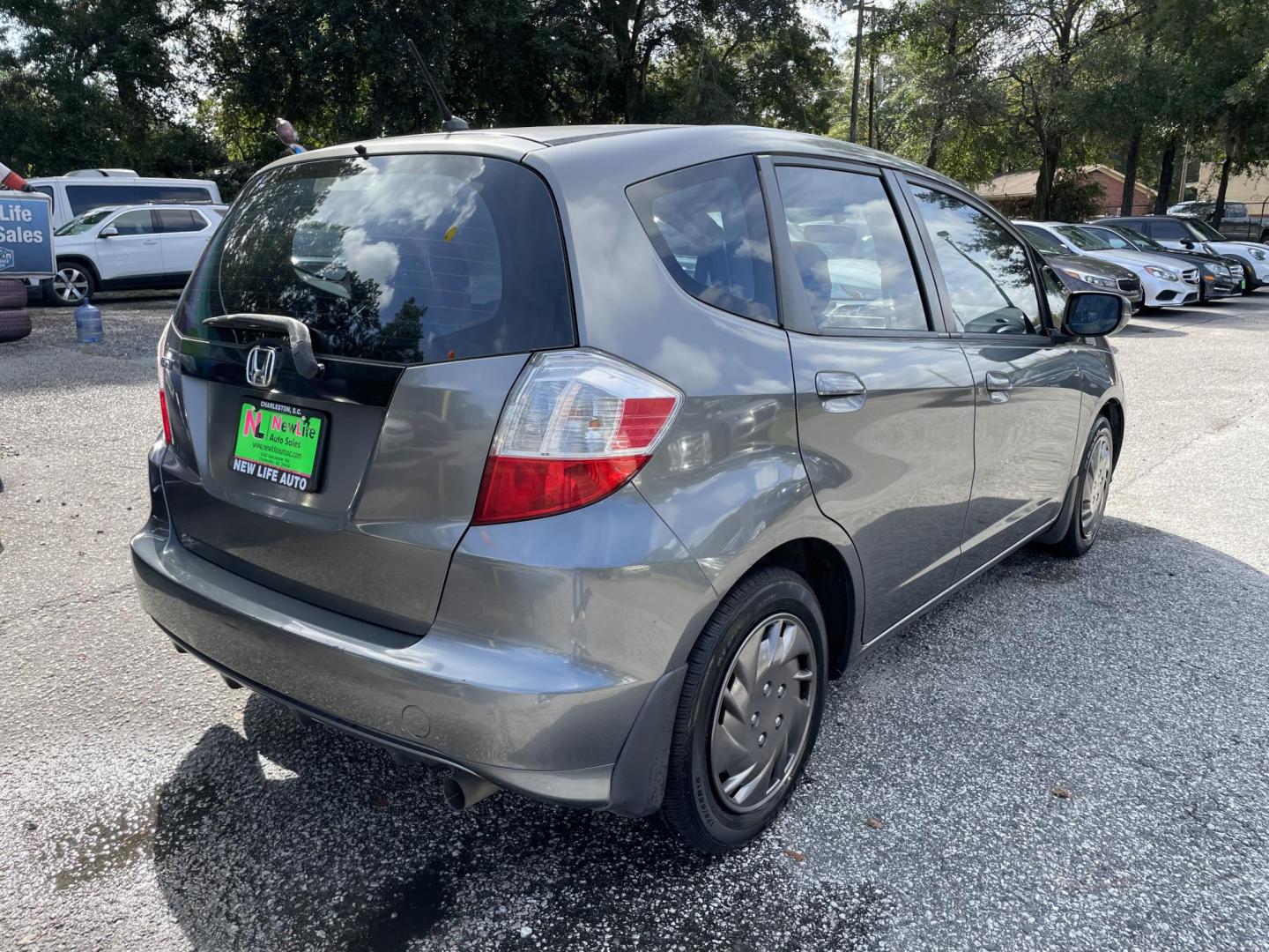 2013 GRAY HONDA FIT BASE (JHMGE8H36DC) with an 1.5L engine, Automatic transmission, located at 5103 Dorchester Rd., Charleston, SC, 29418-5607, (843) 767-1122, 36.245171, -115.228050 - Clean Interior with CD/AUX/AM/FM, Power Windows, Keyless Entry, Spacious Cargo! Local Trade-in!!167k miles Located at New Life Auto Sales! 2023 WINNER for Post & Courier's Charleston's Choice Pre-owned Car Dealer AND 2018-2024 Top 5 Finalist for Charleston City Paper's BEST PLACE TO BUY A USED CAR! - Photo#6